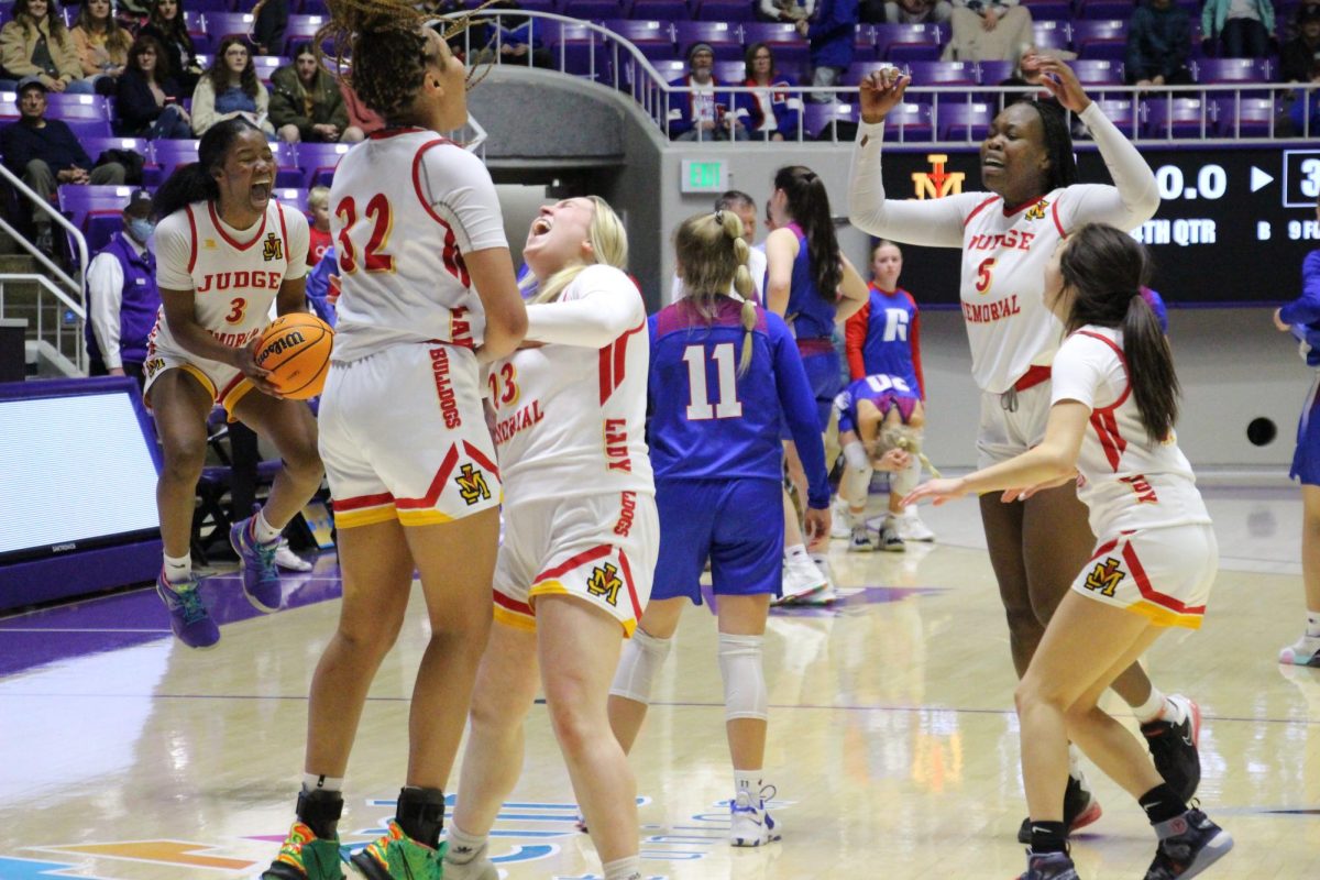 The team celebrates their state championship as the game ends.