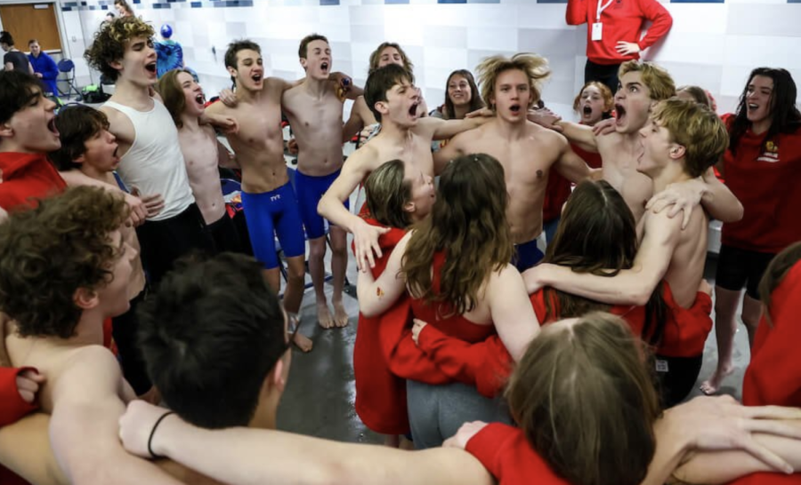 The boys and girls teams celebrate their state championships.