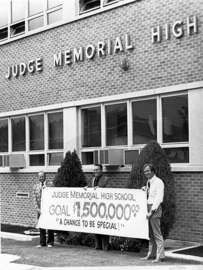 Members of the fundraising committee hold a banner to show that they exceeded their original goal of $1 million.