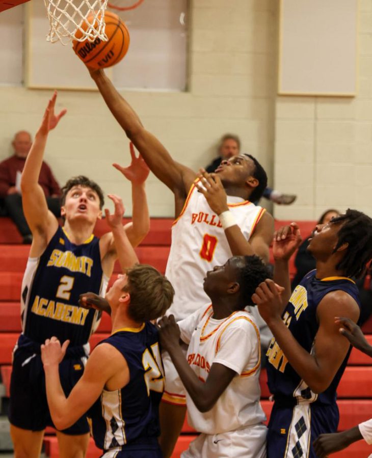 Manase Mangala grabs a rebound in a Jan. 25 home game. The Bulldogs lost to Summit Academy 51-47.