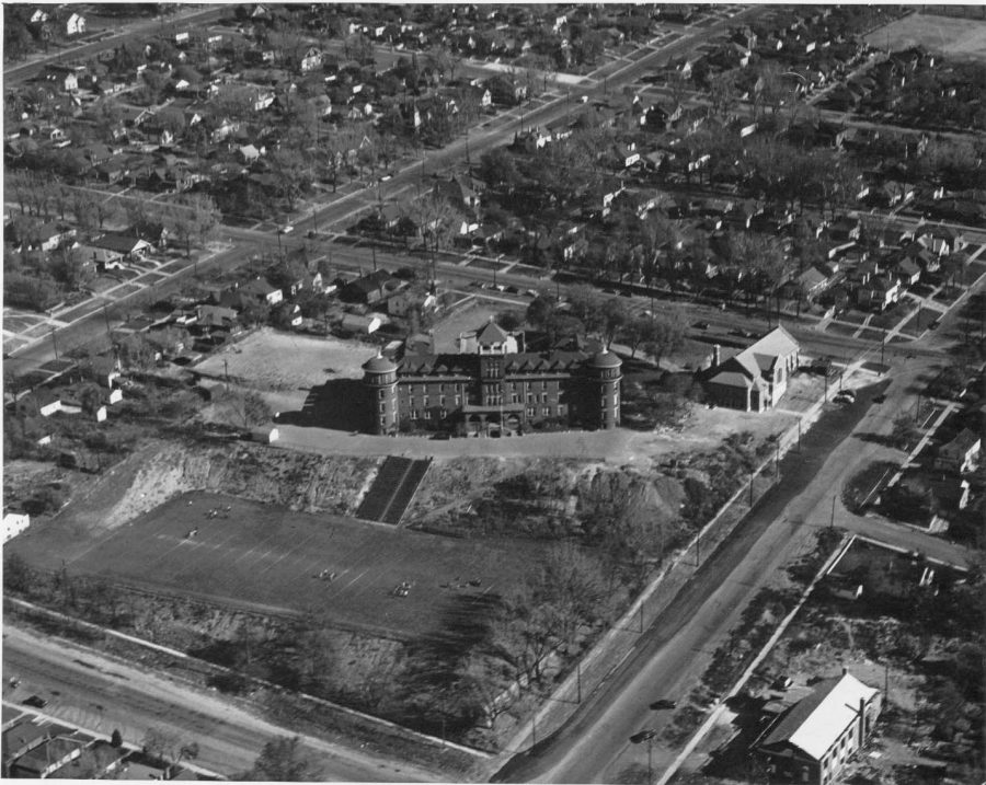 Overhead view of the campus showing the original hospital and, behind it, the new gym and auditorium.