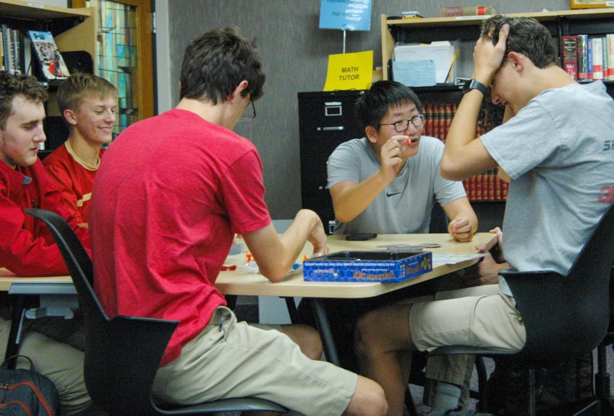 Leo Xu celebrates a victorious move at the September 8 Judge Adventuring Guild meeting. Members of JAG meet every Friday after school in the Learning Commons.