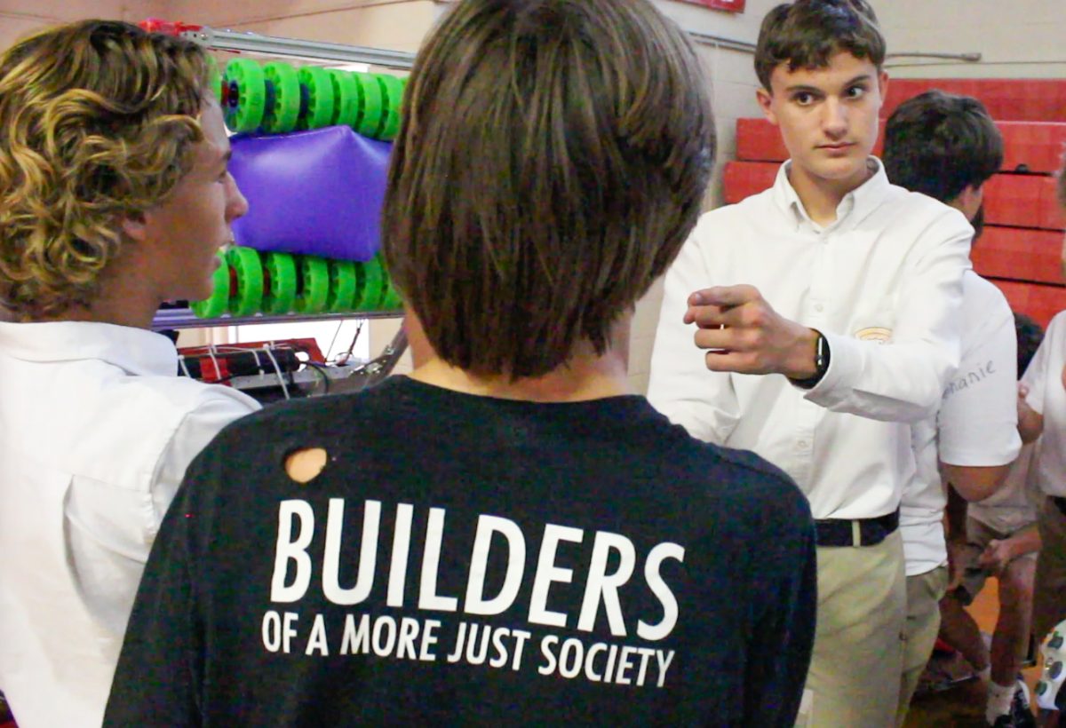 Henry Krauss attempts to recruit more members for the Robotics Club at the Activities Fair on Aug. 18. Judge currently has over 35 student-run clubs.