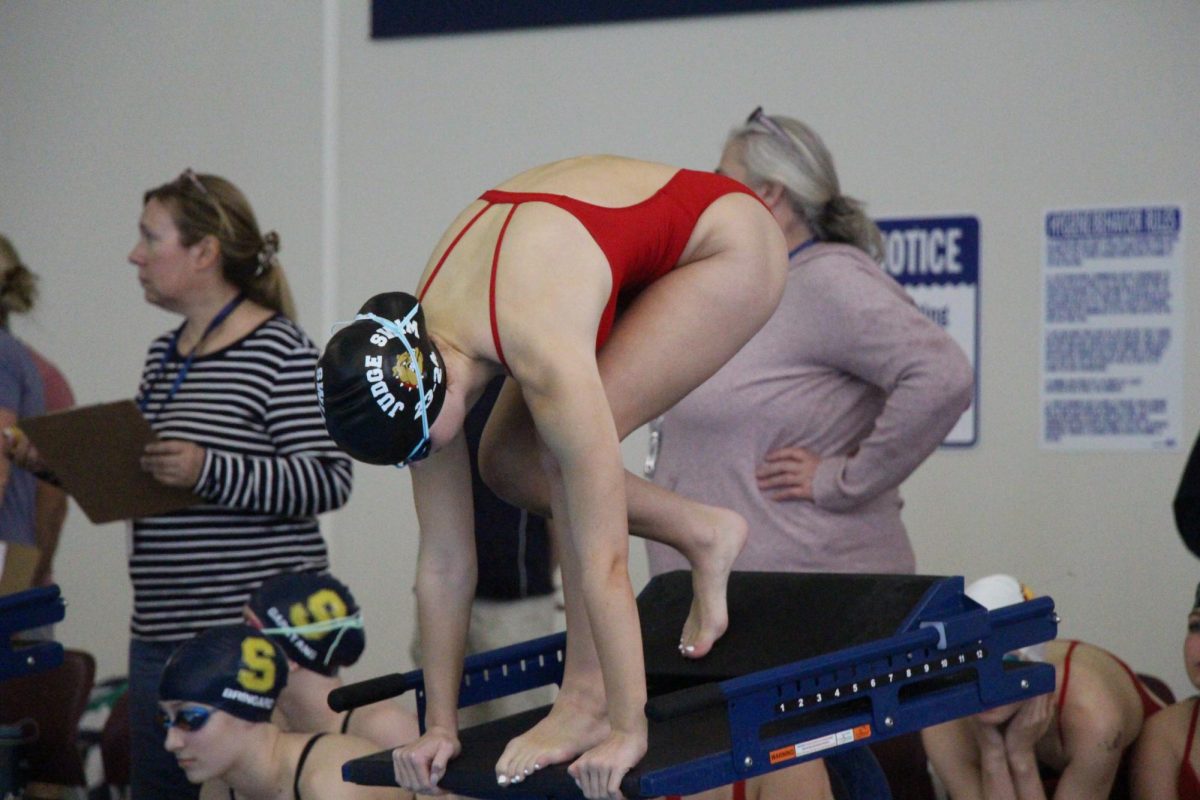 Junior Delaney Dolan lines up on the block. She owns the fastest times in four events in 3A this season. 