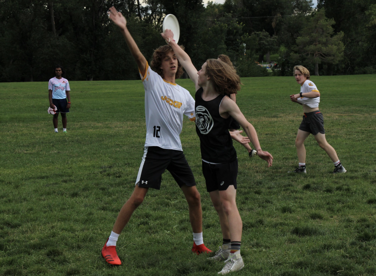 Sam Macklyn guards Will Yarrish at an Ultimate Frisbee practice.