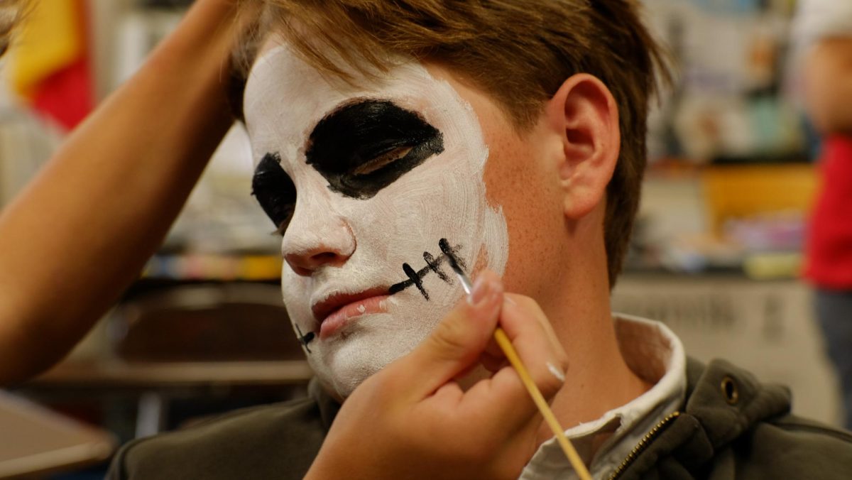 Wilkes Herrod gets his face painted in Ms. Aida Shepherd's class as part of their Dia de los Muertos activity.