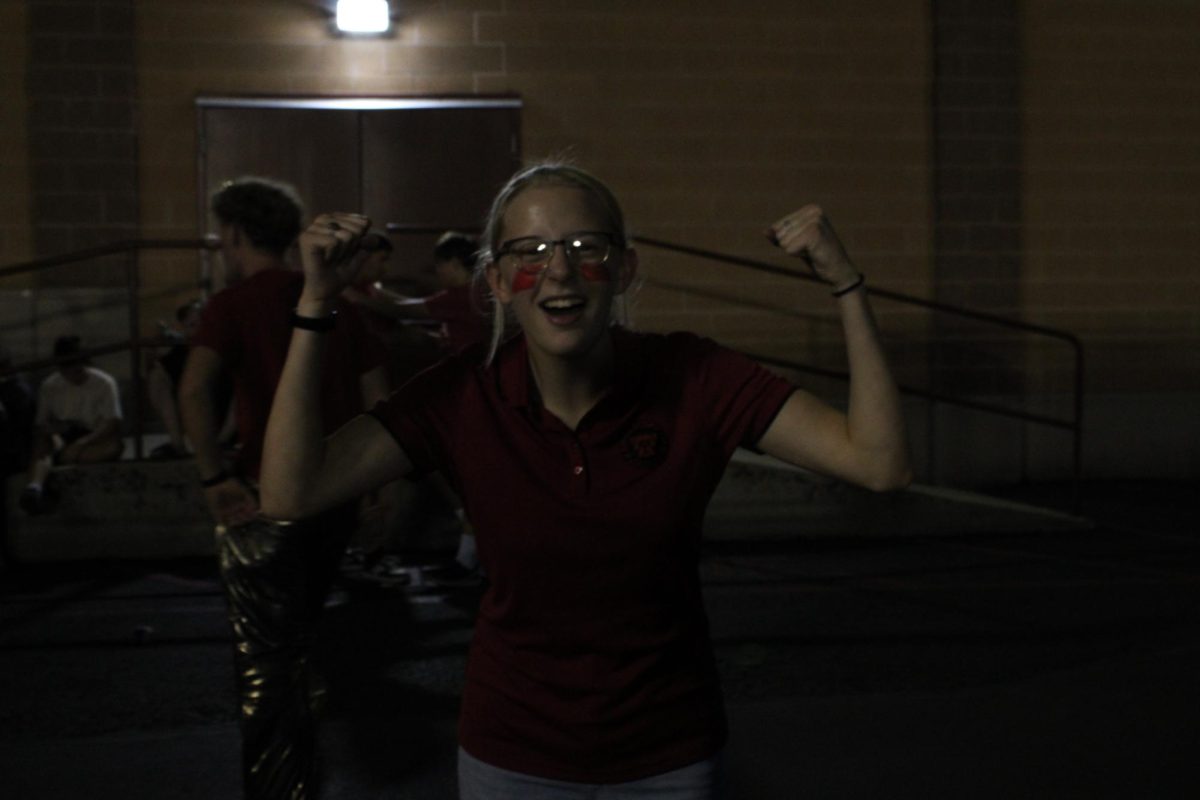 An exited fan at the Homecoming football game.