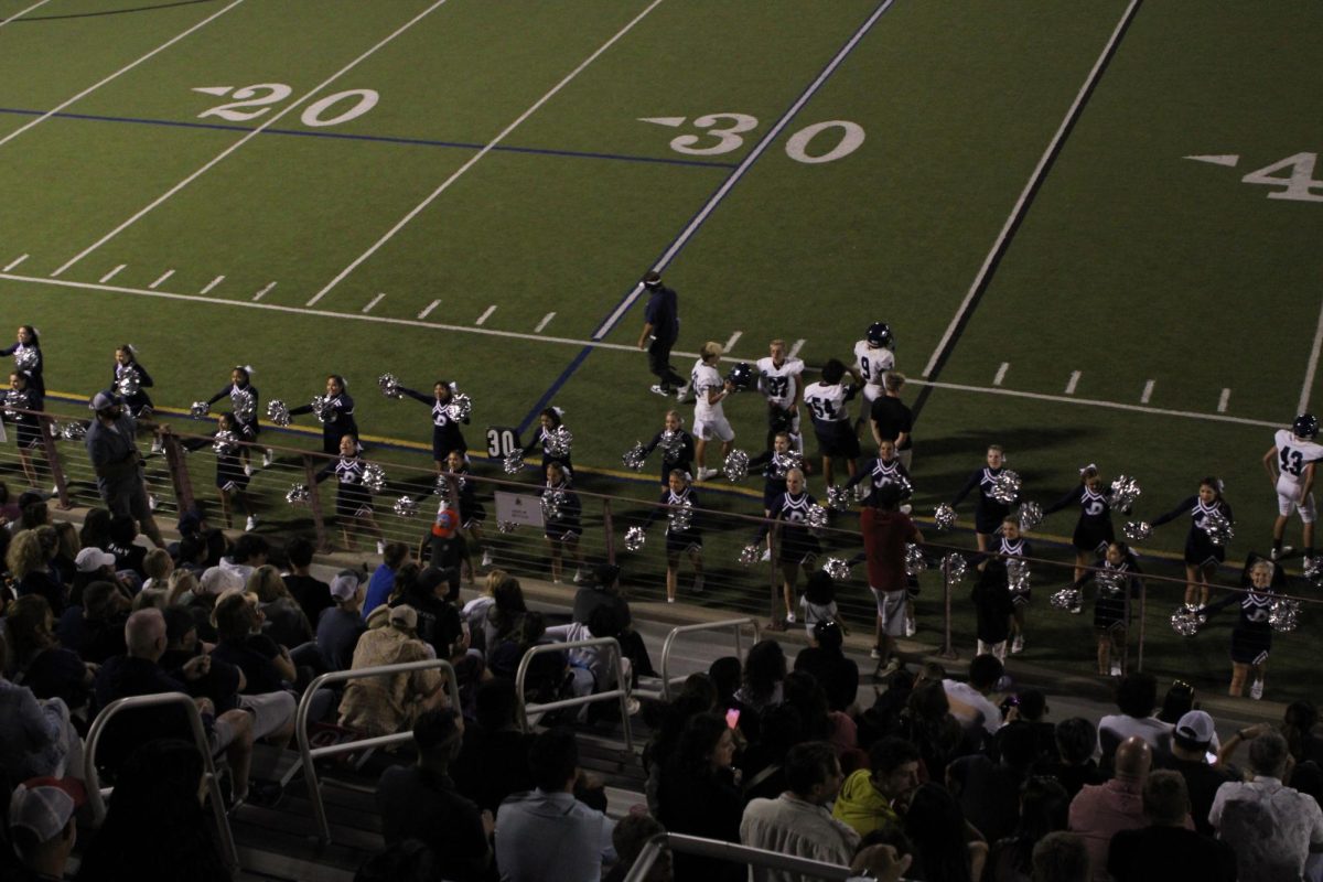 The Juan Diego cheerleaders at the Homecoming football game.